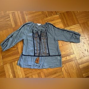 Blue blouse with embroidered detail. Mid length sleeves. Size M.